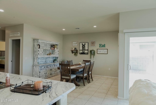 dining room featuring light tile patterned flooring, recessed lighting, and baseboards