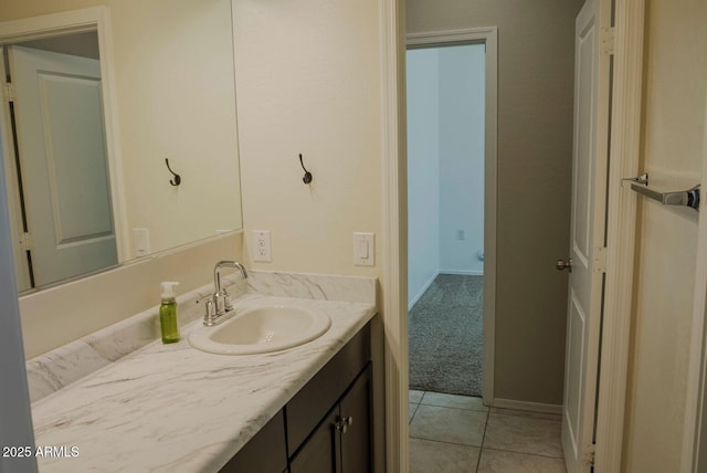 bathroom featuring vanity, tile patterned floors, and baseboards
