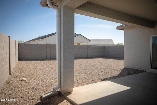 view of yard with a patio and a fenced backyard