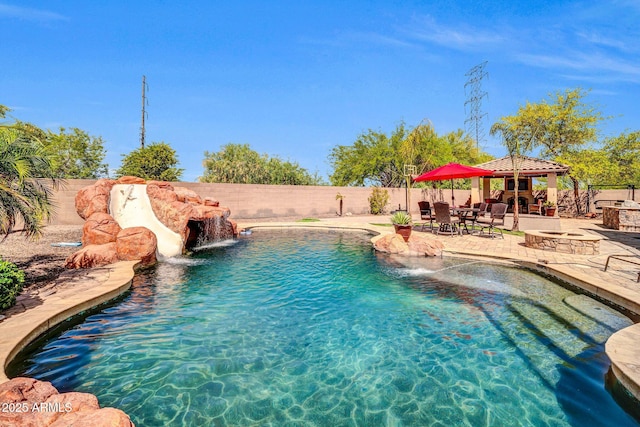 11965 W Monte Vista Rd, Avondale, AZ 85392 - view of swimming pool with a gazebo, a water slide, a patio, and a fenced backyard