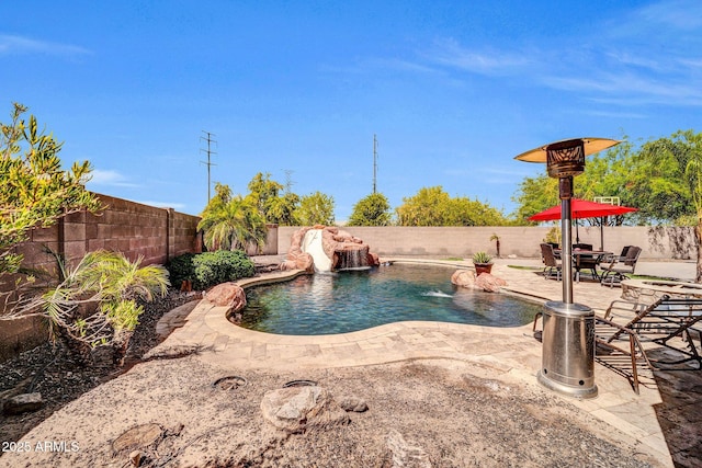 11965 W Monte Vista Rd, Avondale, AZ 85392 - view of swimming pool featuring a fenced backyard, a patio area, and a water slide