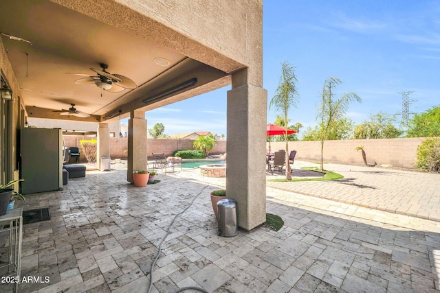 11965 W Monte Vista Rd, Avondale, AZ 85392 - fenced backyard with a ceiling fan, a patio, and outdoor dining space
