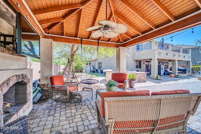 11965 W Monte Vista Rd, Avondale, AZ 85392 - view of patio / terrace with an outdoor living space with a fireplace, ceiling fan, and a gazebo