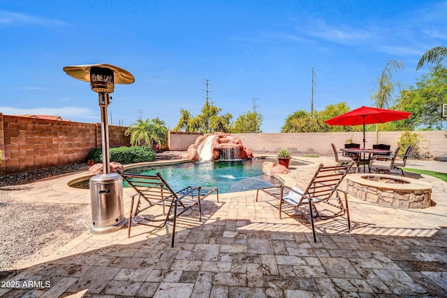 11965 W Monte Vista Rd, Avondale, AZ 85392 - view of pool with a water slide, a fenced backyard, a patio area, and outdoor dining area