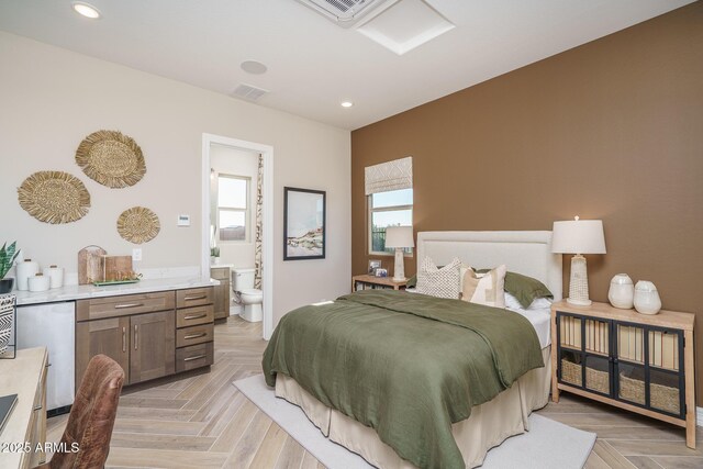 43712 N Acadia Way, New River, AZ 85087 - bedroom with recessed lighting, connected bathroom, and fridge