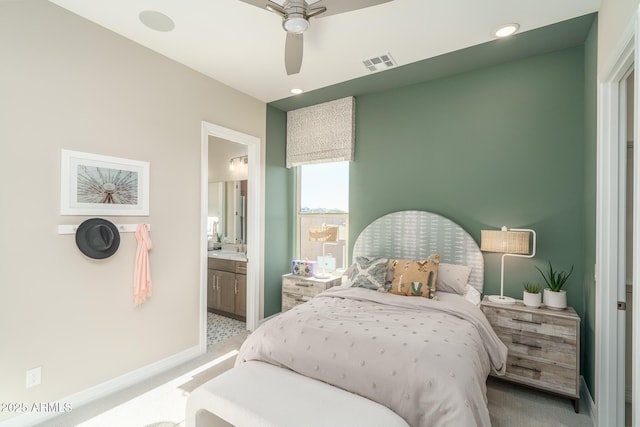 43712 N Acadia Way, New River, AZ 85087 - bedroom with light colored carpet, connected bathroom, baseboards, a ceiling fan, and recessed lighting