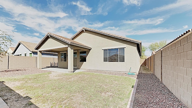 23853 W Hammond Ln, Buckeye, AZ 85326 - rear view of property featuring a patio, a fenced backyard, and stucco siding