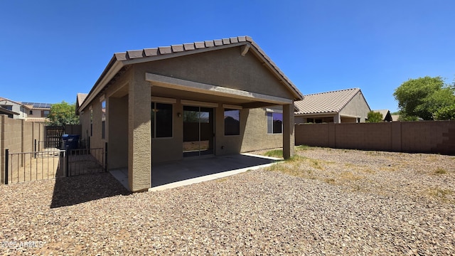 23853 W Hammond Ln, Buckeye, AZ 85326 - rear view of property featuring stucco siding, a patio area, and a fenced backyard