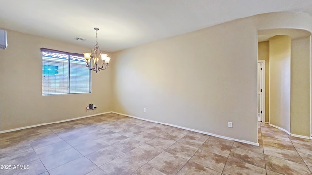 23853 W Hammond Ln, Buckeye, AZ 85326 - spare room with light tile patterned floors, a chandelier, and arched walkways