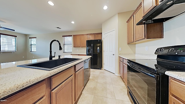 23853 W Hammond Ln, Buckeye, AZ 85326 - kitchen featuring black appliances, under cabinet range hood, light tile patterned flooring, recessed lighting, and light stone countertops