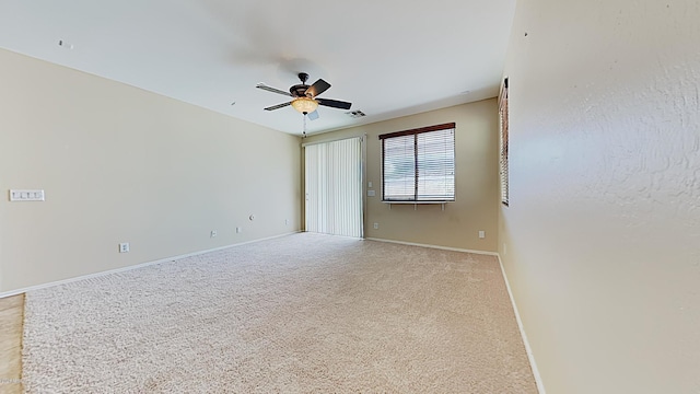 23853 W Hammond Ln, Buckeye, AZ 85326 - empty room with a ceiling fan and light carpet
