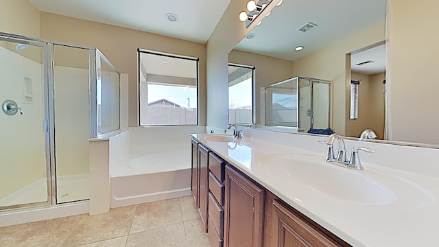 23853 W Hammond Ln, Buckeye, AZ 85326 - bathroom with a shower stall, a bath, double vanity, and tile patterned flooring
