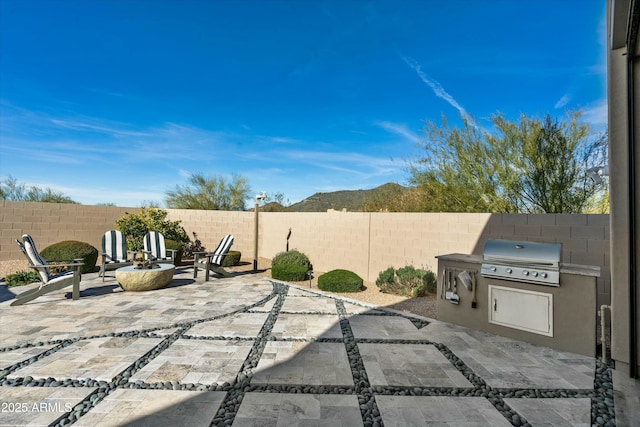 view of patio featuring a fenced backyard and area for grilling