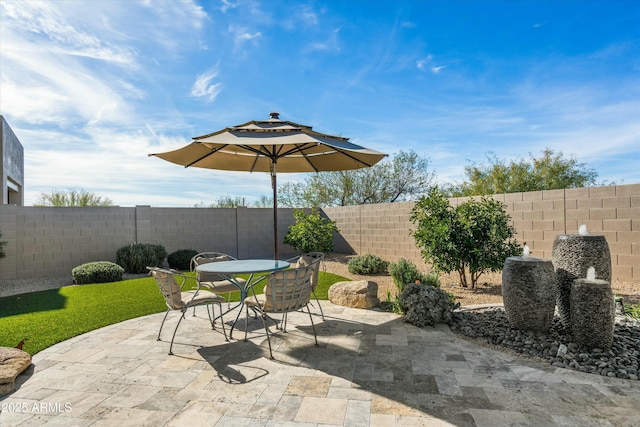 view of patio / terrace with a fenced backyard and outdoor dining area