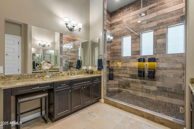 bathroom with vanity and a stall shower