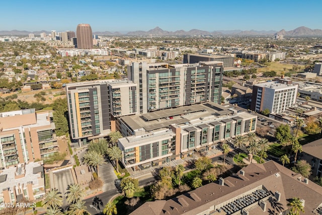 birds eye view of property featuring a mountain view