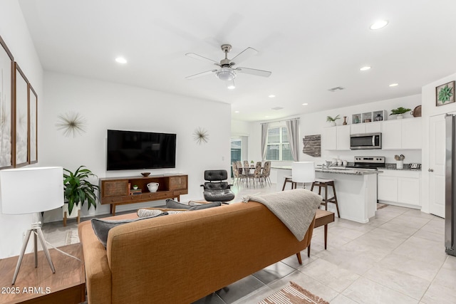 living room featuring ceiling fan