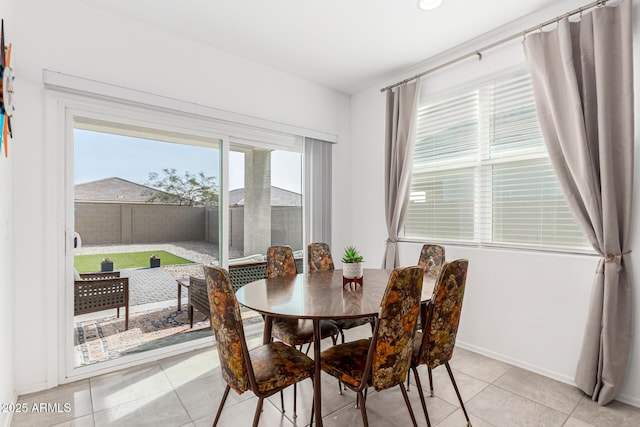 dining space with light tile patterned floors