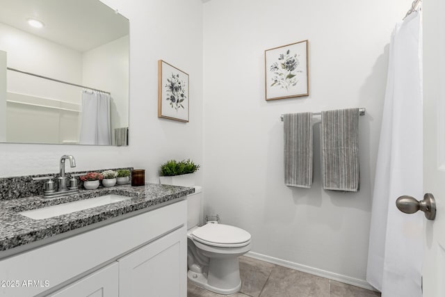 bathroom featuring tile patterned flooring, vanity, a shower with curtain, and toilet