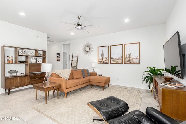 tiled living room featuring ceiling fan