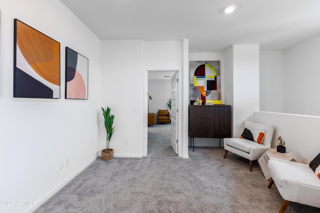 living area with light carpet