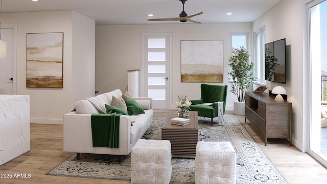 living area with ceiling fan and light wood-type flooring