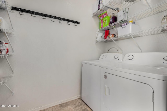 laundry area with independent washer and dryer, laundry area, and baseboards