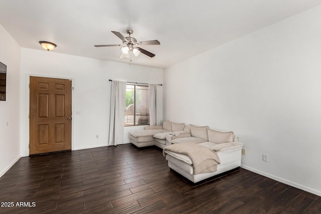 unfurnished living room with a ceiling fan, dark wood-style flooring, and baseboards