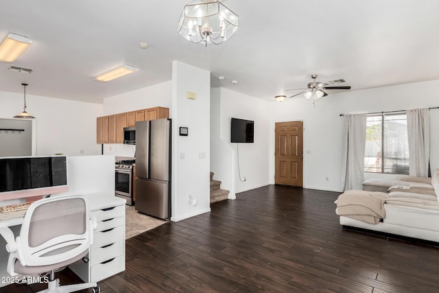 interior space featuring baseboards, dark wood-style floors, visible vents, and ceiling fan with notable chandelier
