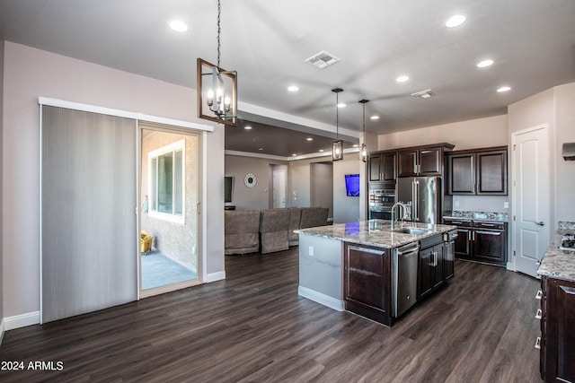 kitchen with stainless steel appliances, dark wood-type flooring, dark brown cabinetry, and visible vents