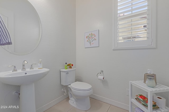 bathroom featuring tile patterned floors, sink, and toilet