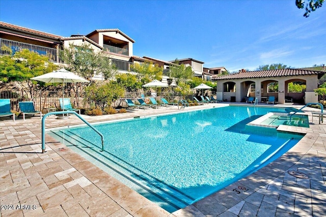 view of swimming pool featuring a patio area