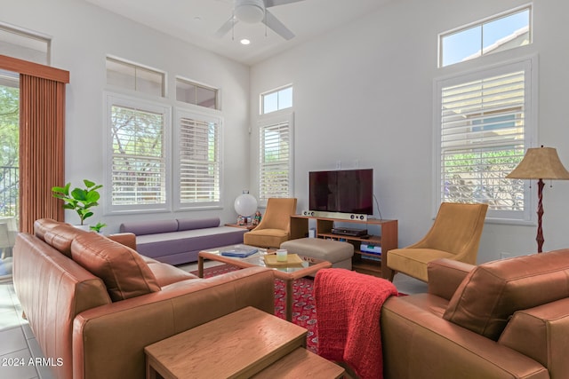 living room featuring ceiling fan and light tile patterned flooring