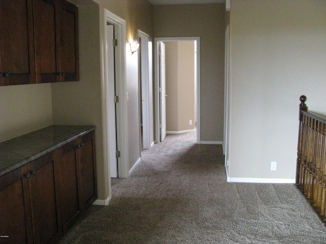 hallway featuring light carpet