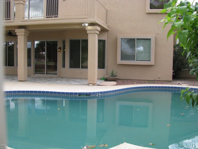 view of swimming pool with a patio area