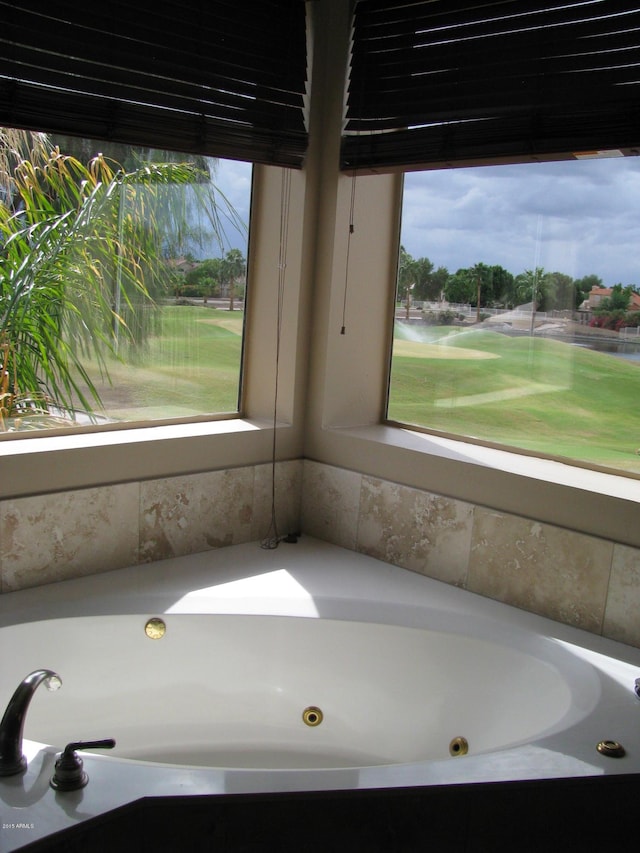 bathroom with a whirlpool tub