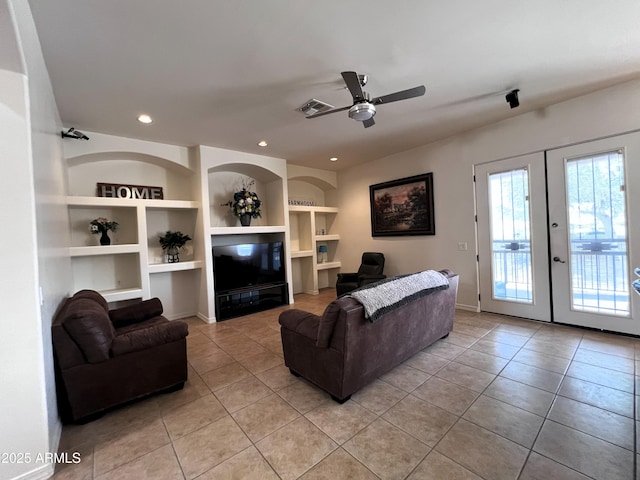 2427 W Desert Hills Estate Dr, Phoenix, AZ 85086 - living room with light tile patterned flooring, built in shelves, french doors, recessed lighting, and a ceiling fan