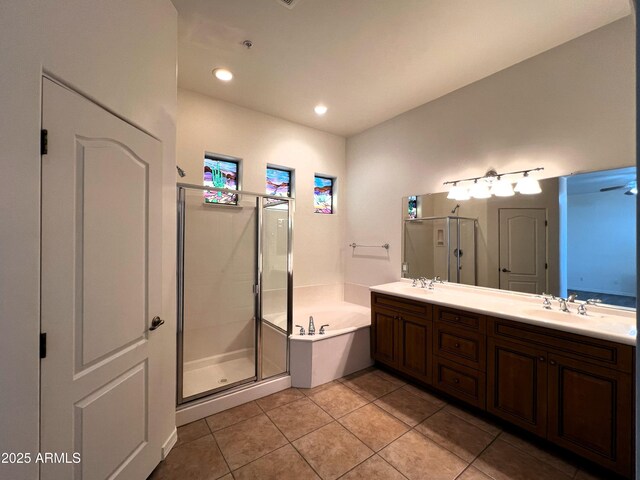 2427 W Desert Hills Estate Dr, Phoenix, AZ 85086 - bathroom with a stall shower, a bath, double vanity, tile patterned flooring, and recessed lighting