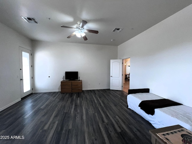 2427 W Desert Hills Estate Dr, Phoenix, AZ 85086 - unfurnished bedroom featuring dark wood-type flooring, baseboards, and ceiling fan