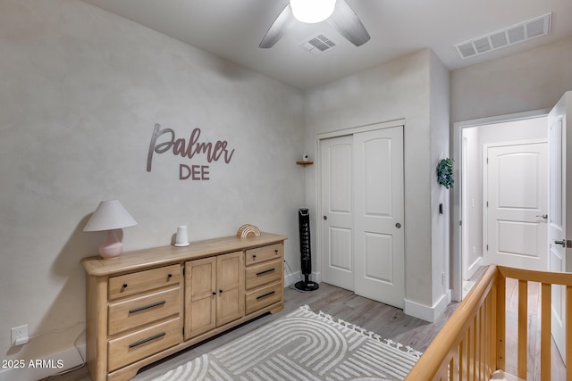 12211 W Hide Trl, Peoria, AZ 85383 - bedroom with light wood-style floors, a closet, and ceiling fan