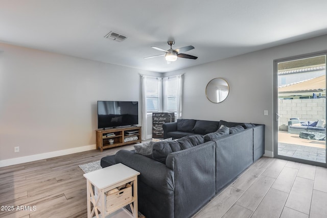 12211 W Hide Trl, Peoria, AZ 85383 - living area with light wood finished floors, ceiling fan, and plenty of natural light