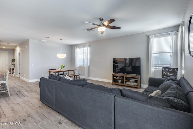 12211 W Hide Trl, Peoria, AZ 85383 - living room featuring ceiling fan and light wood-style floors