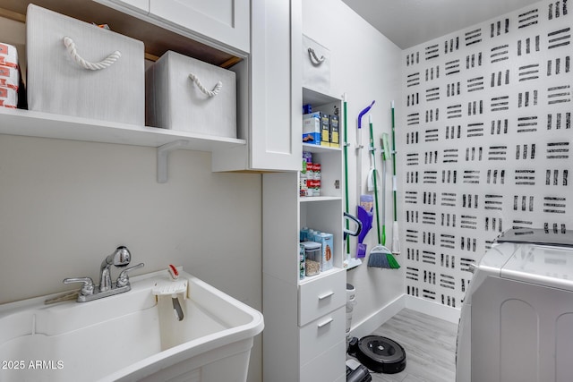 12211 W Hide Trl, Peoria, AZ 85383 - bathroom with washing machine and clothes dryer and wood finished floors