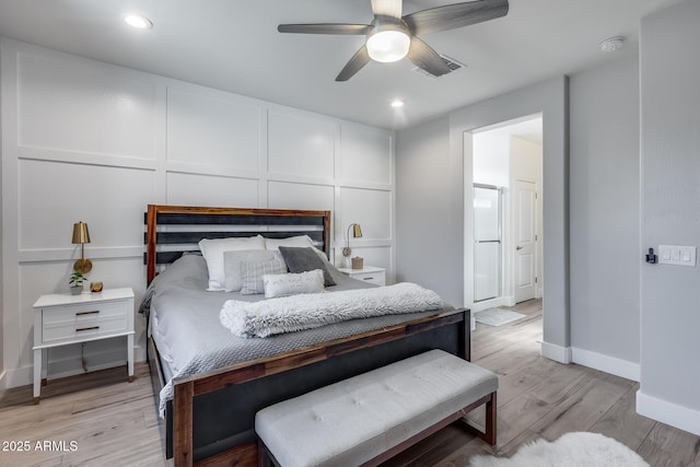 12211 W Hide Trl, Peoria, AZ 85383 - bedroom with light wood-style flooring, recessed lighting, ensuite bath, and ceiling fan