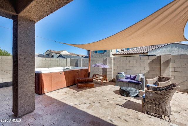 12211 W Hide Trl, Peoria, AZ 85383 - fenced backyard featuring a hot tub, a patio, and an outdoor living space