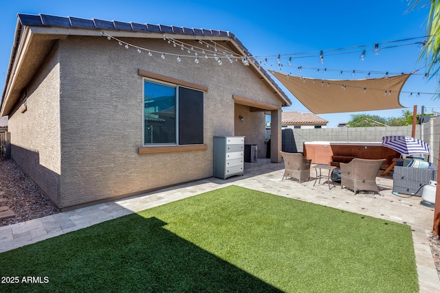 12211 W Hide Trl, Peoria, AZ 85383 - back of property featuring stucco siding, a patio, and a fenced backyard