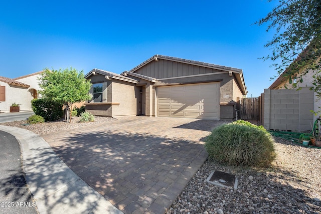 12211 W Hide Trl, Peoria, AZ 85383 - single story home featuring an attached garage, decorative driveway, a tile roof, and stucco siding