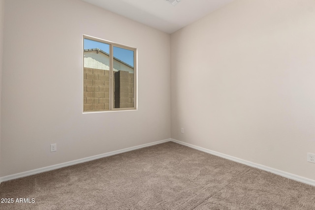 spare room featuring carpet floors