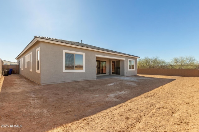 rear view of property with a patio area