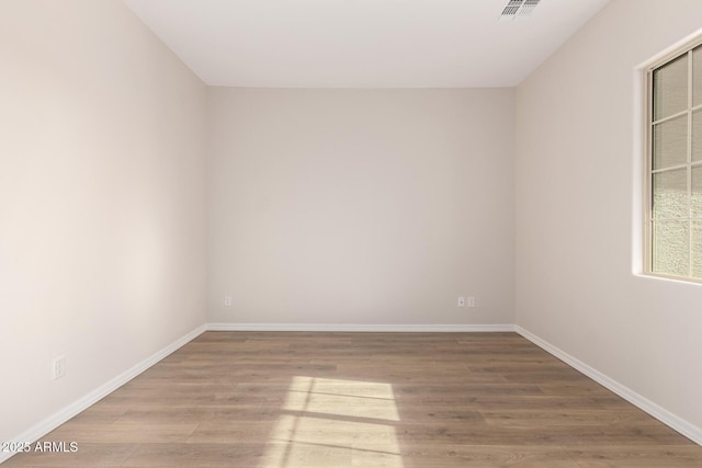 unfurnished room featuring wood-type flooring